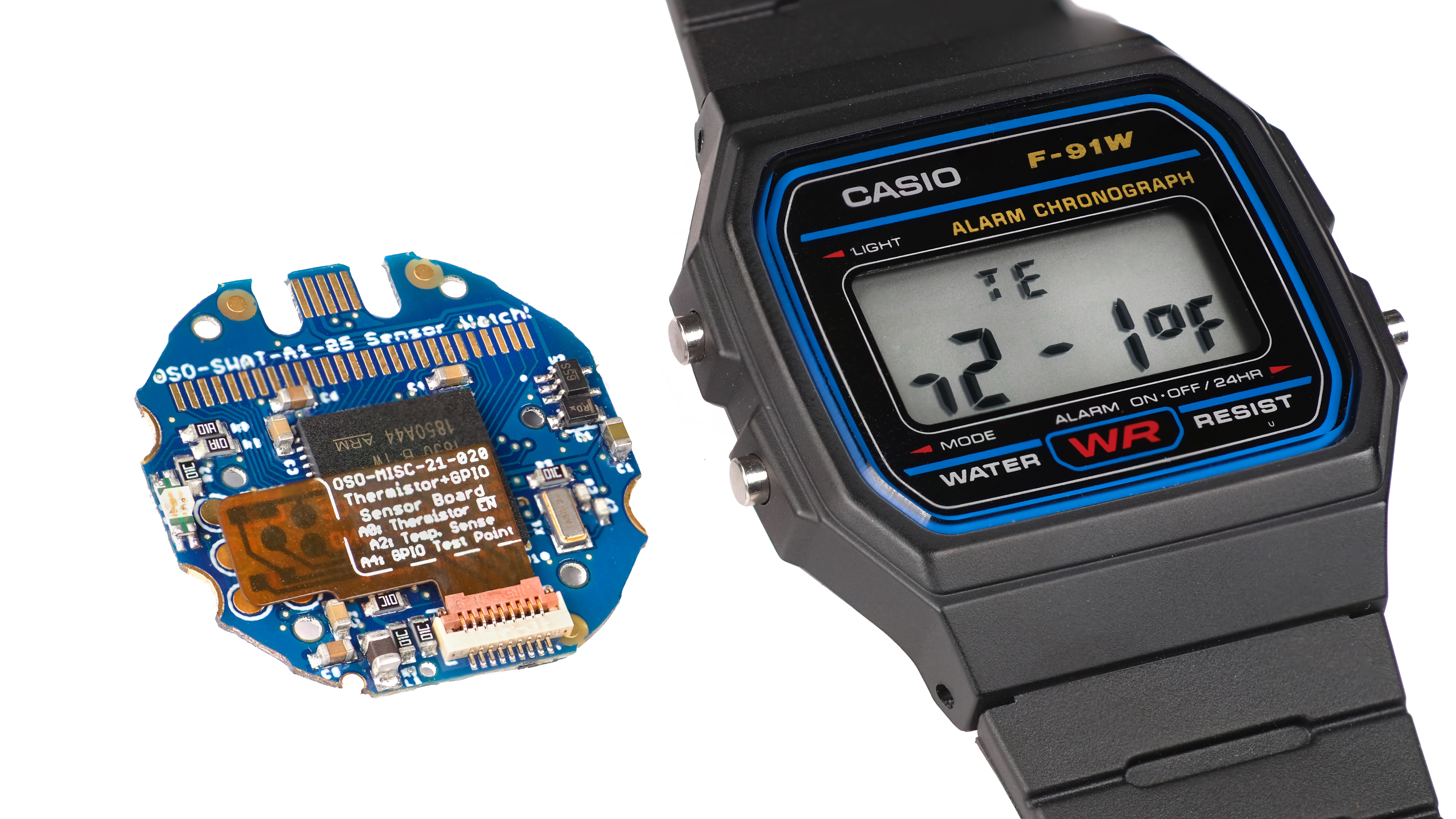 Photo: the Sensor Watch circuit board next to a Casio F-91W