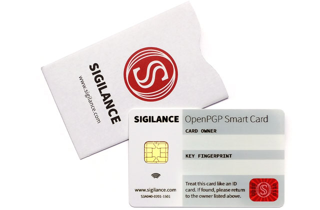 A product shot of the SIGILANCE OpenPGP Smart Card, sitting on top of an RFID-blocking sleeve for the same.